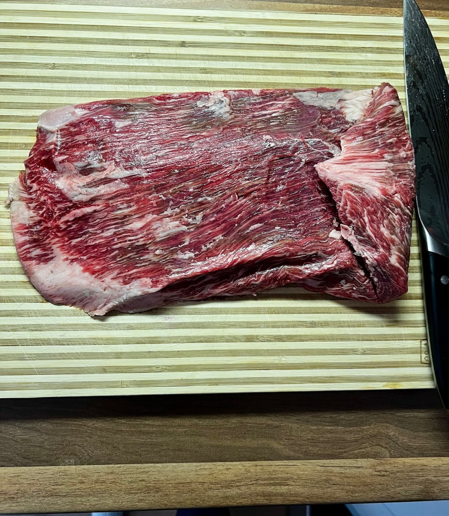SRF flank steak on a wooden cutting board