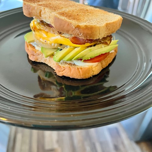 Ultimate breakfast sandwich on a black plate