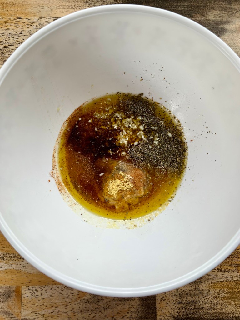 Honey Dijon marinade ingredients in a mixing bowl
