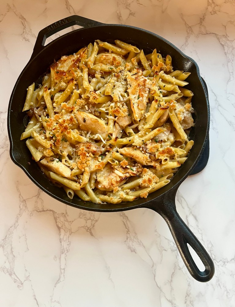 Chicken Marsala Bake in a cast iron skillet on a marble countertop