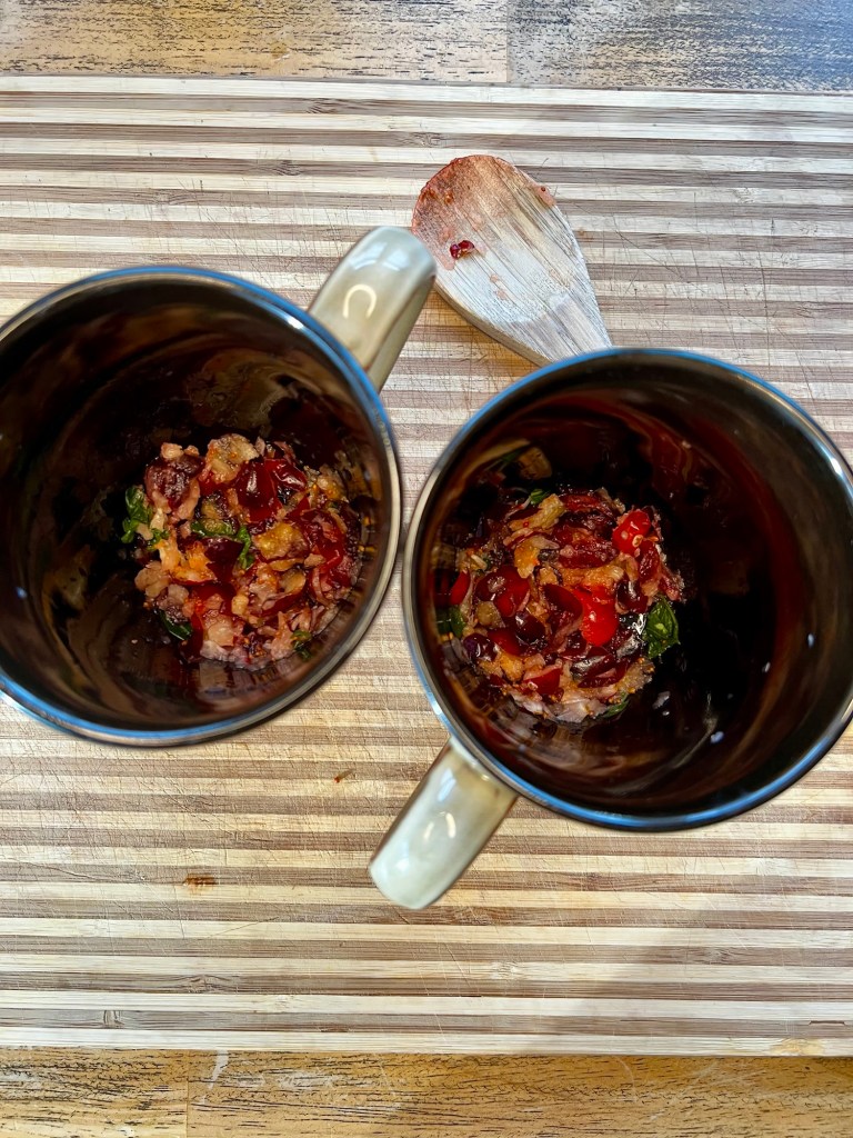 Cranberry and basil muddled in some mugs