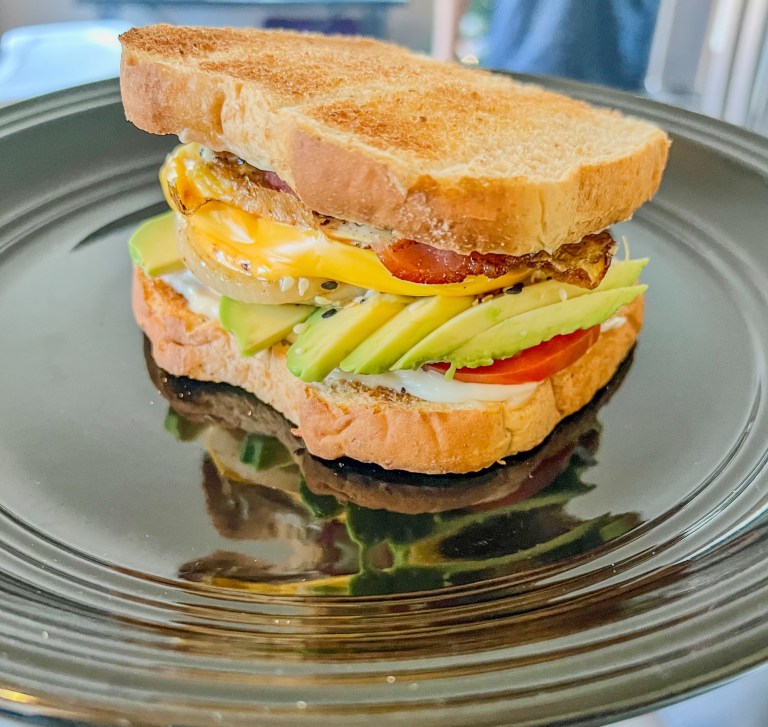 Ultimate breakfast sandwich on a black plate