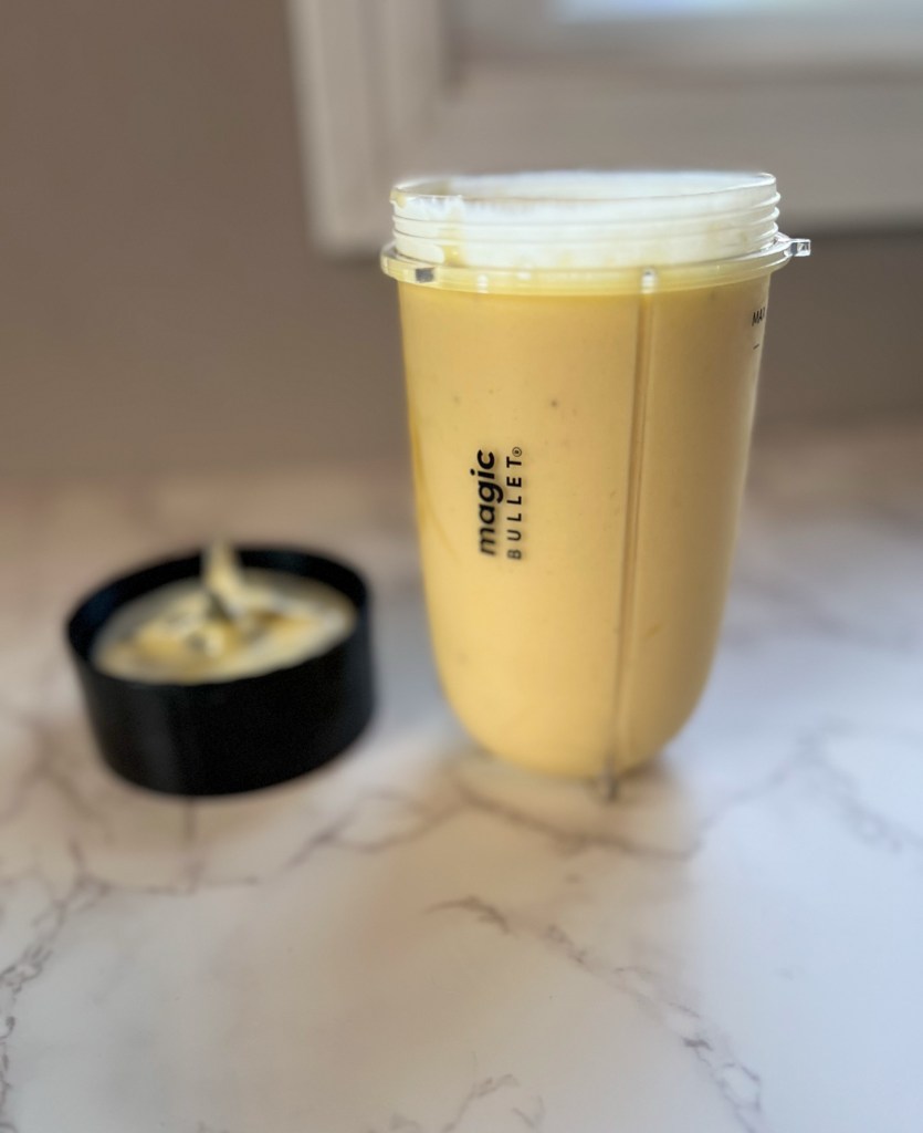 Freshly blended smoothie in a bullet cup on a countertop