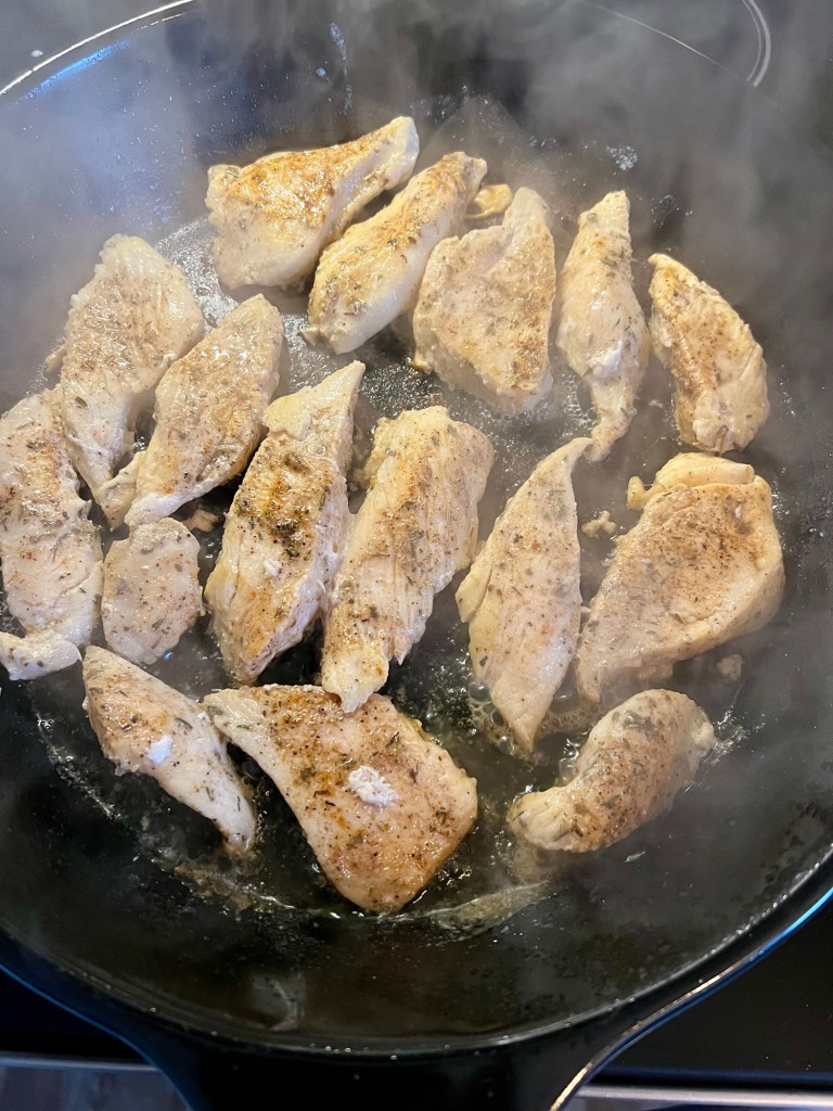 Chicken cooking in an Xtrema pan on the stove