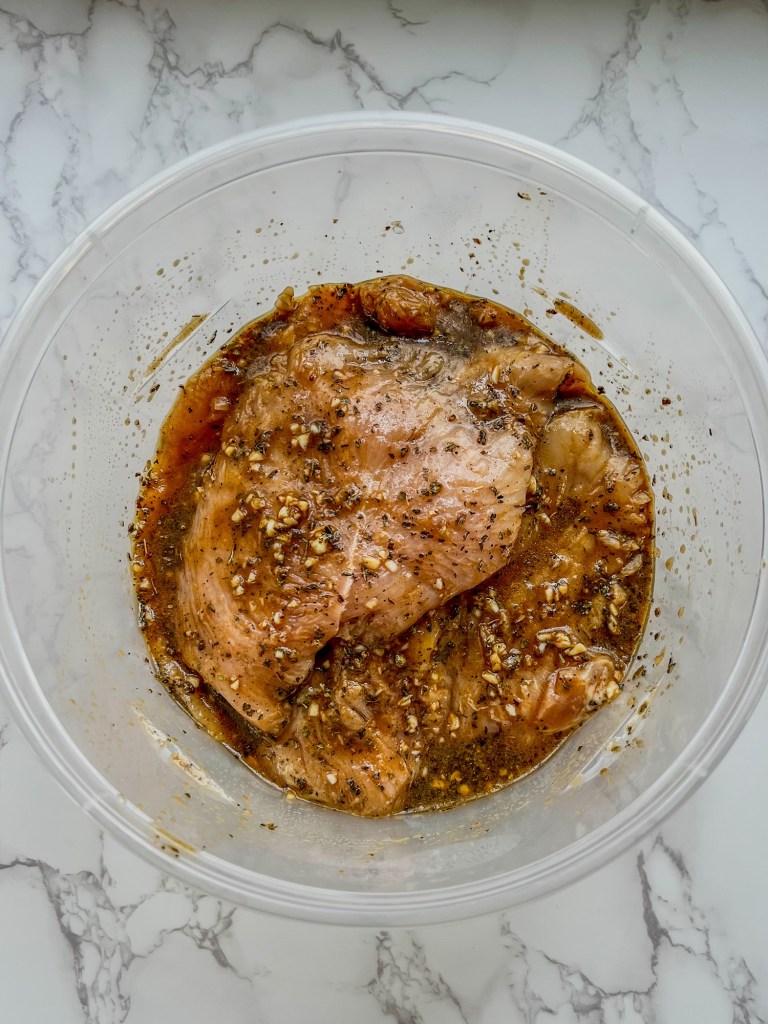 Chicken breast that's been tossed in balsamic chicken marinade