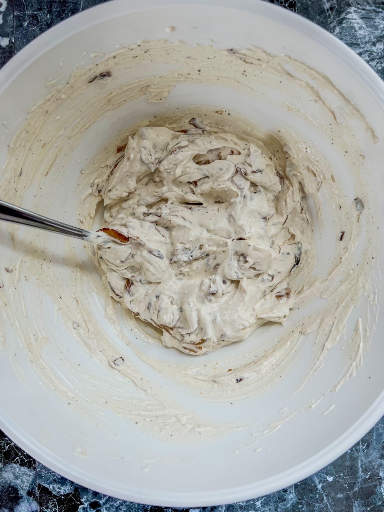 Ingredients mixed up in a bowl to make french onion dip