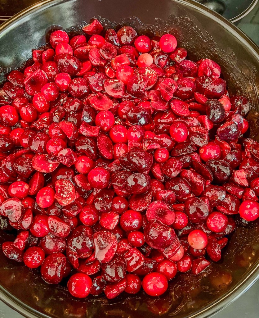 Cherry cranberry cobbler filling cooking in an Xtrema pan