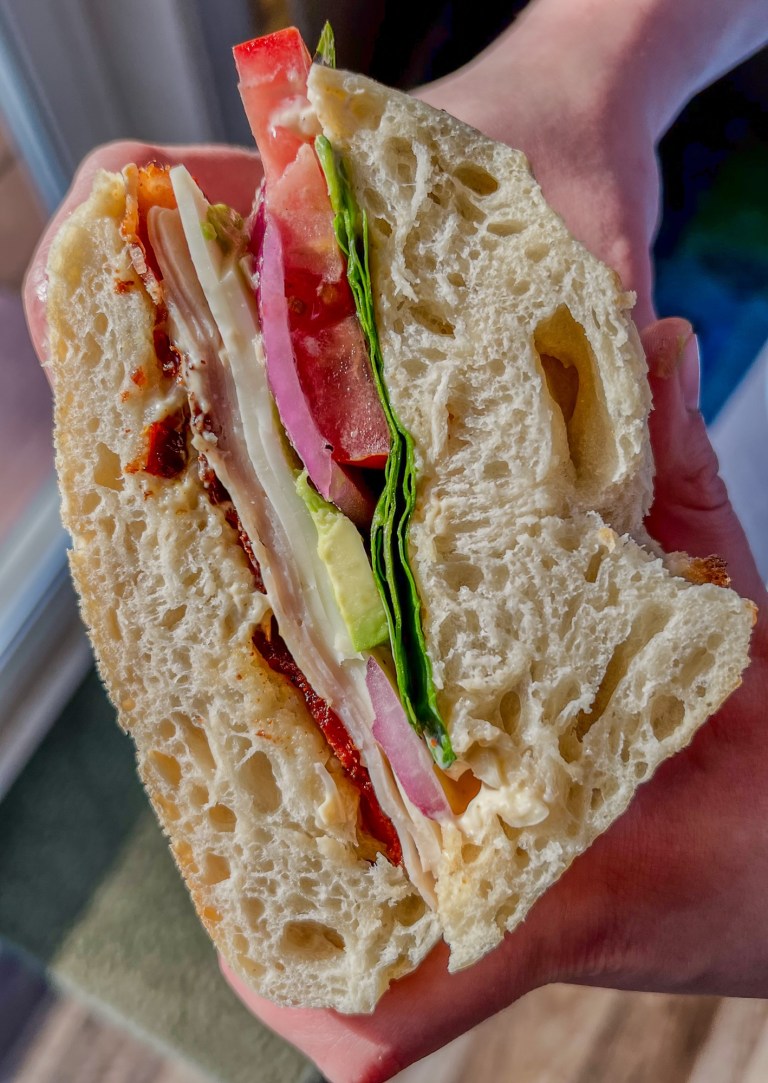 A garden club that's been cut in half and being held to show the inside