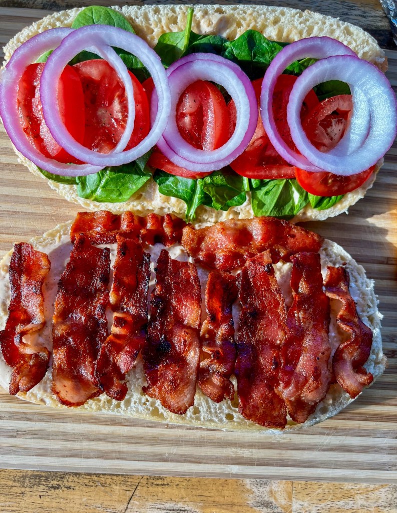 A garden club being assembled on a wooden cutting board