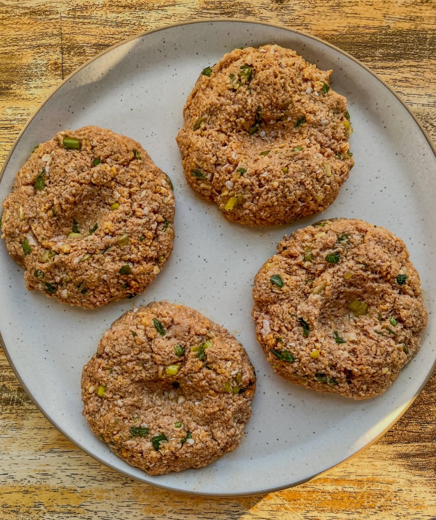 Raw green onion turkey burger patties ready to be cooked