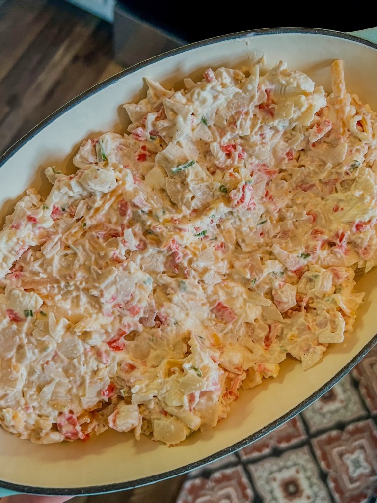 Hot crab dip in a baking dish just before going into the oven