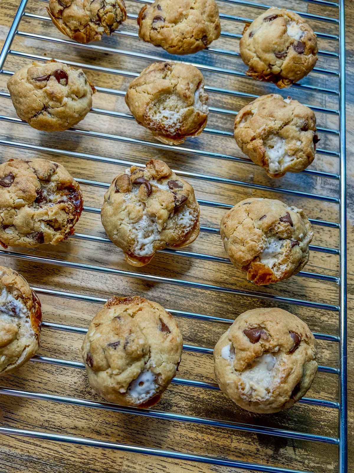 Chocolate Chip Coconut Marshmallow Cookies on a cooling rack on a wooden table