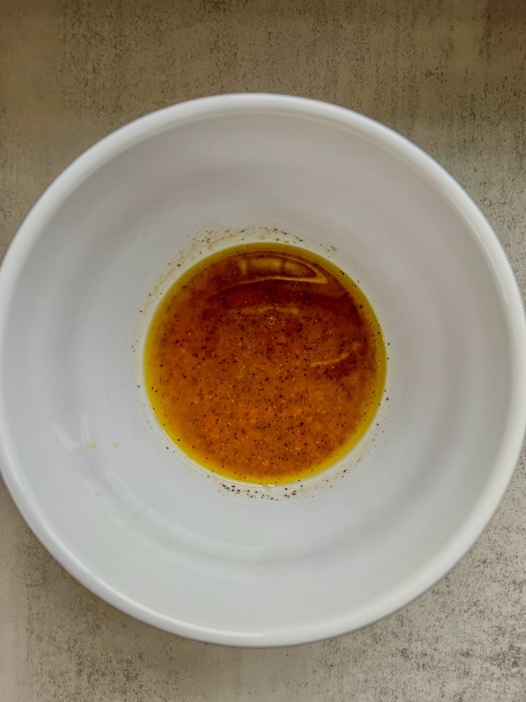 Red wine vinaigrette in a mixing bowl
