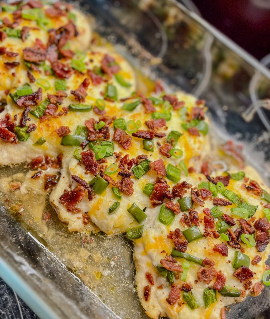Jalapeño Popper Chicken in a glass baking dish