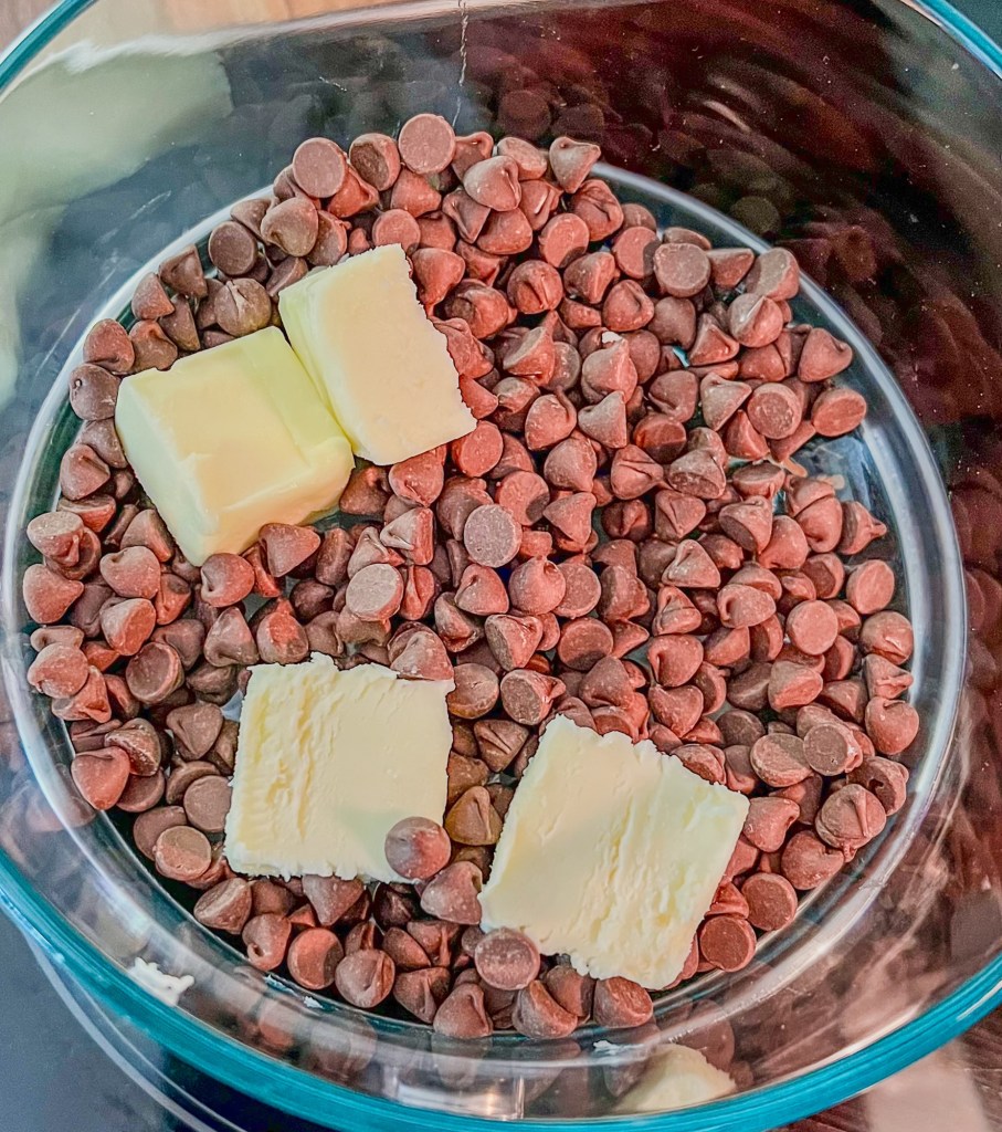 Chocolate chips and butter being melted on the stove
