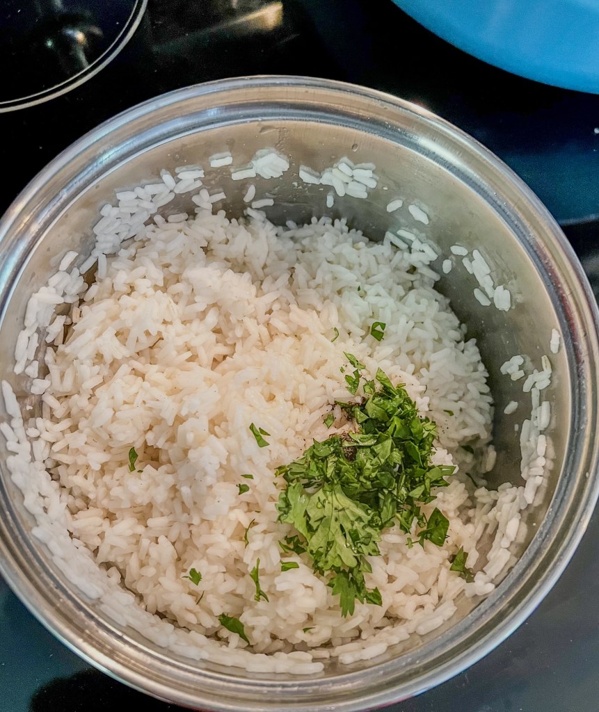Cilantro lime rice in a small saucepan on the stove