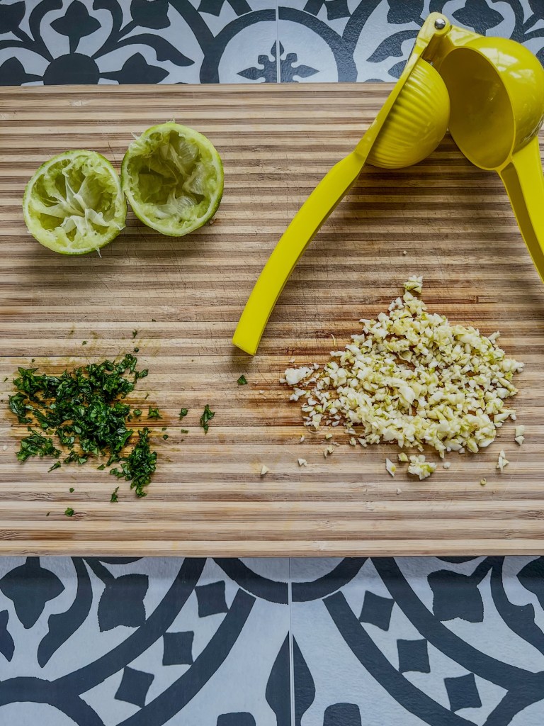 Ingredients for steak kabob marinade on a wooden cutting board