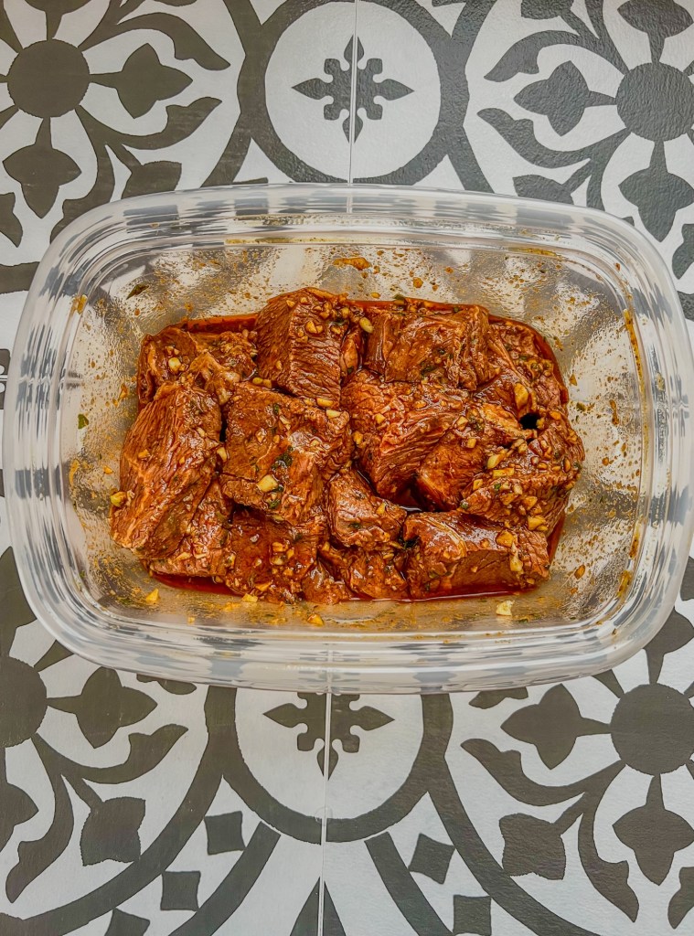 Large sirloin chunks in chili-lime marinade in a Tupperware