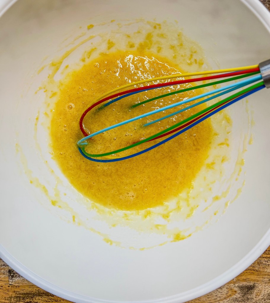 Batter forming in a bowl for lemon loaf