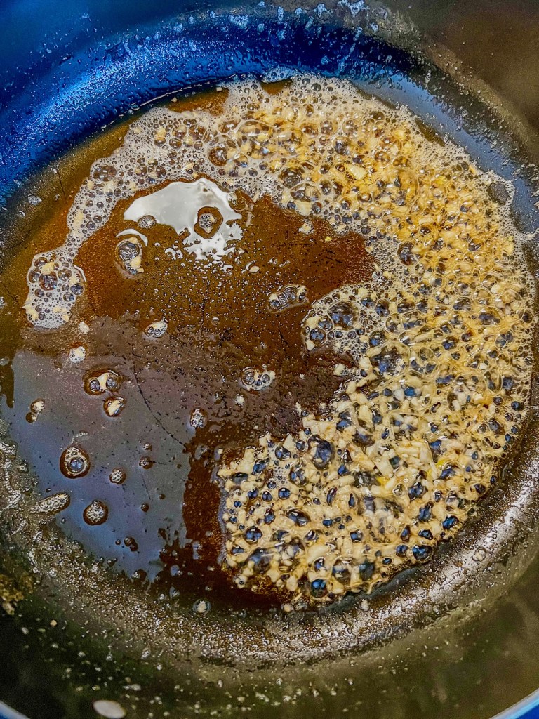 Brown butter and garlic cooking in a skillet