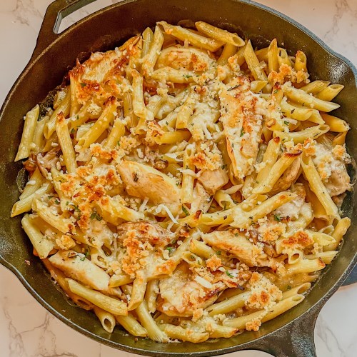 Chicken Marsala Bake in a cast iron skillet on a marble countertop