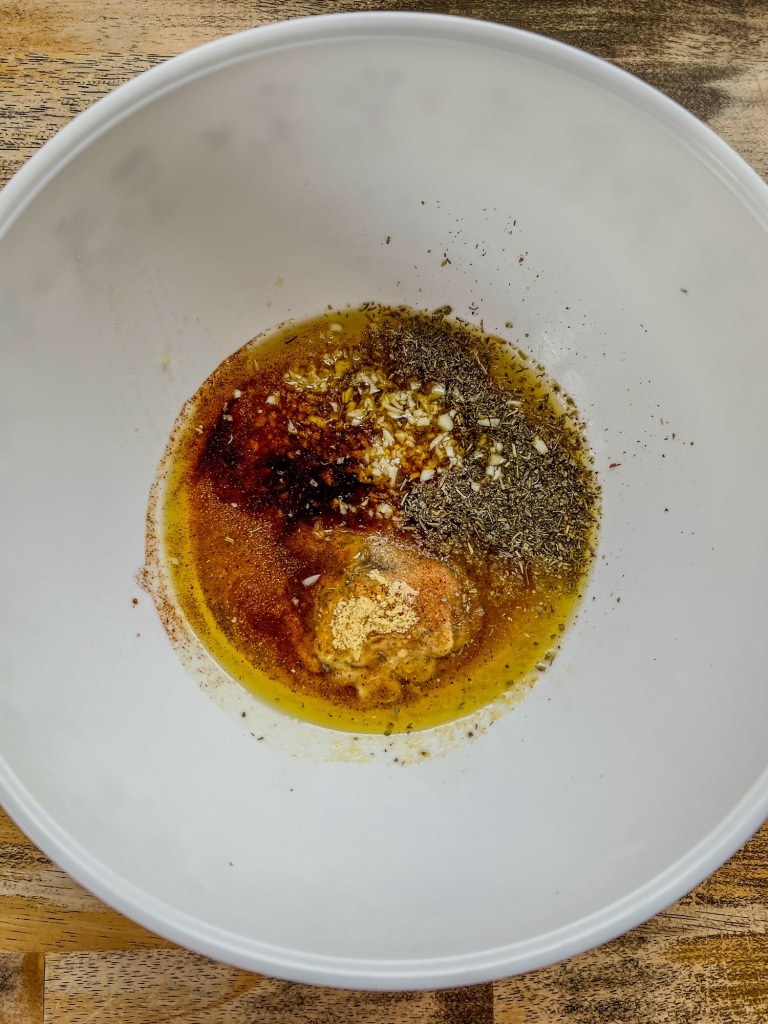 Honey Dijon marinade ingredients in a mixing bowl
