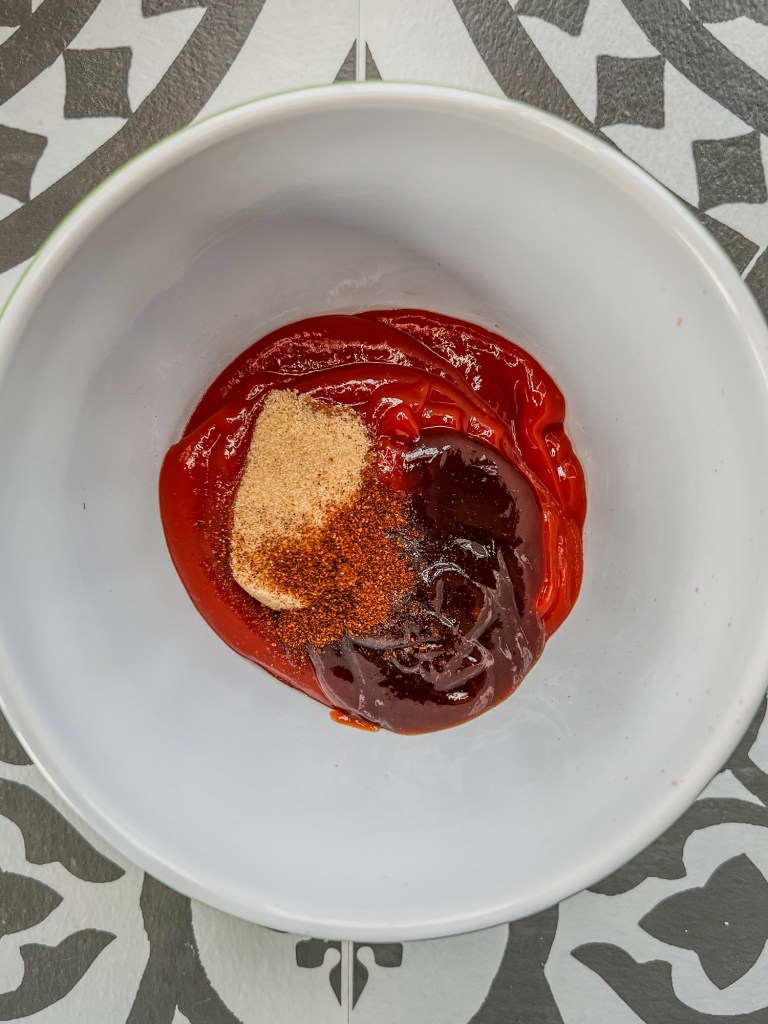 Ingredients to make meatloaf glaze in a bowl before being combined