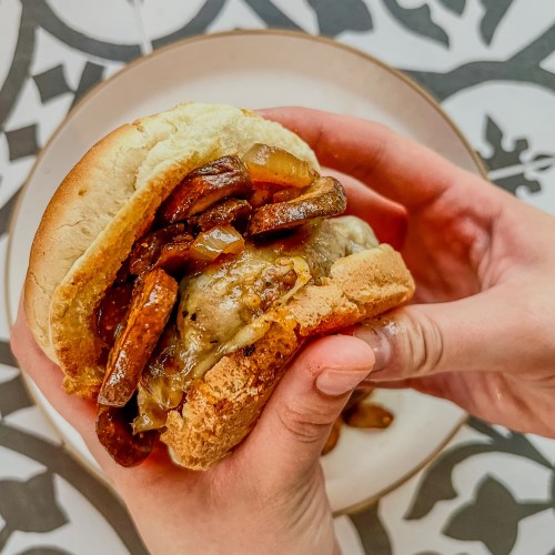 Mushroom and swiss burgers with one being held up to show the inside
