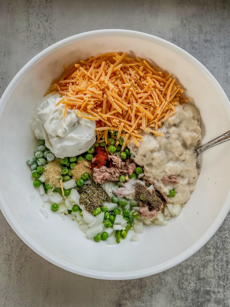 Casserole ingredients in a large mixing bowl before being stirred