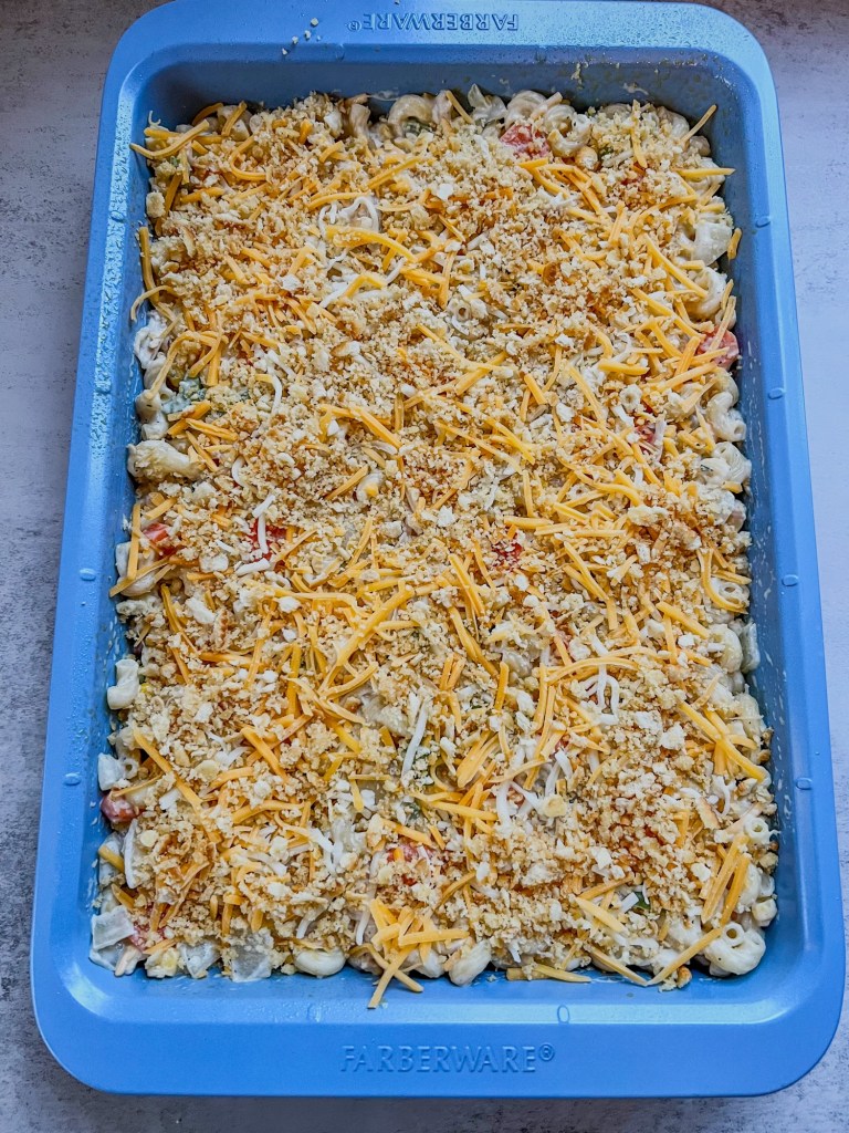 Turkey noodle casserole in a blue baking pan, about to go into the oven