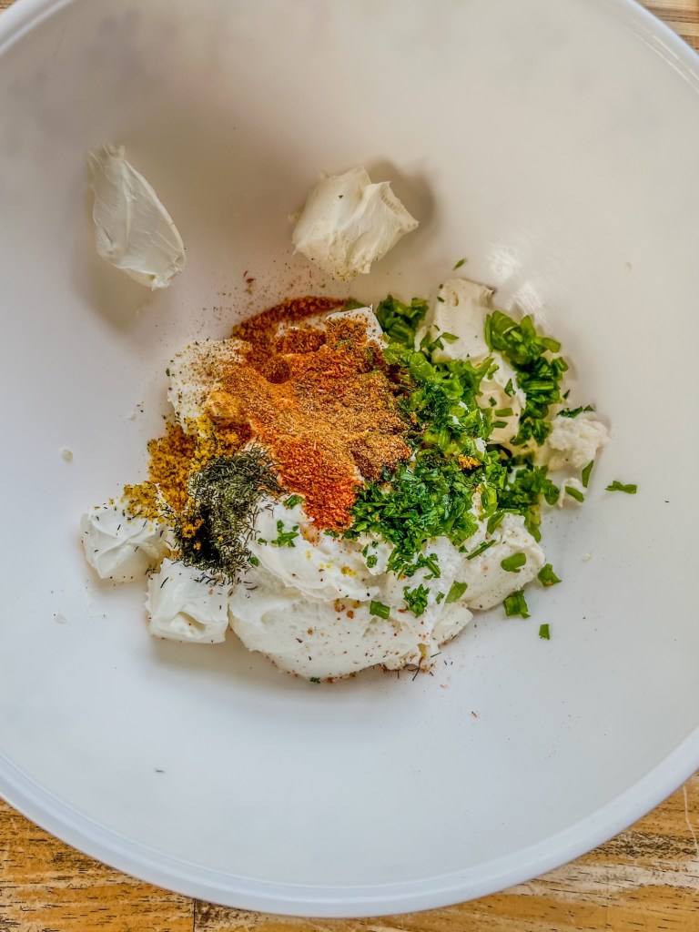 Filling ingredients for warm shrimp rolls in a large mixing bowl