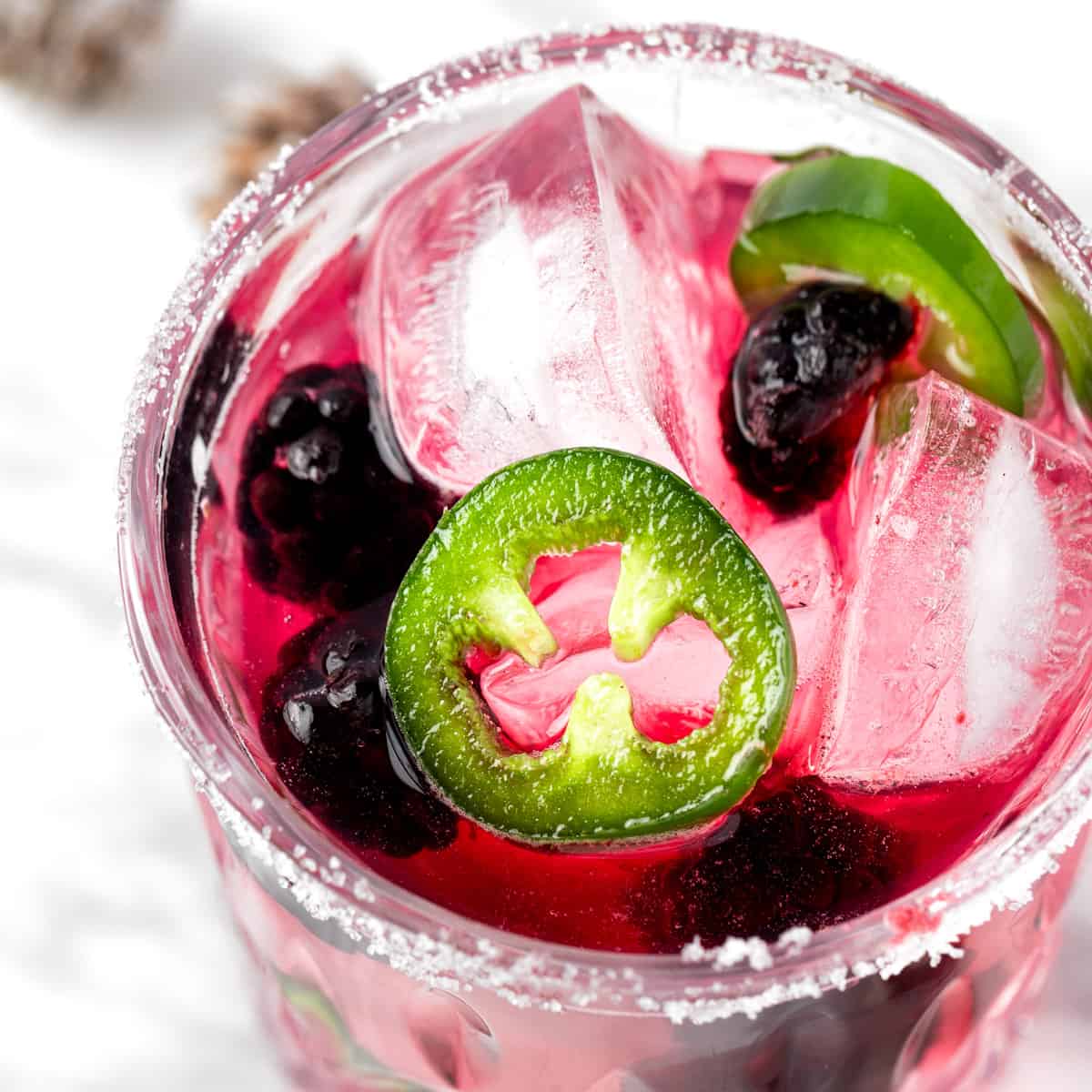 Blackberry jalapeño margarita served on the rocks