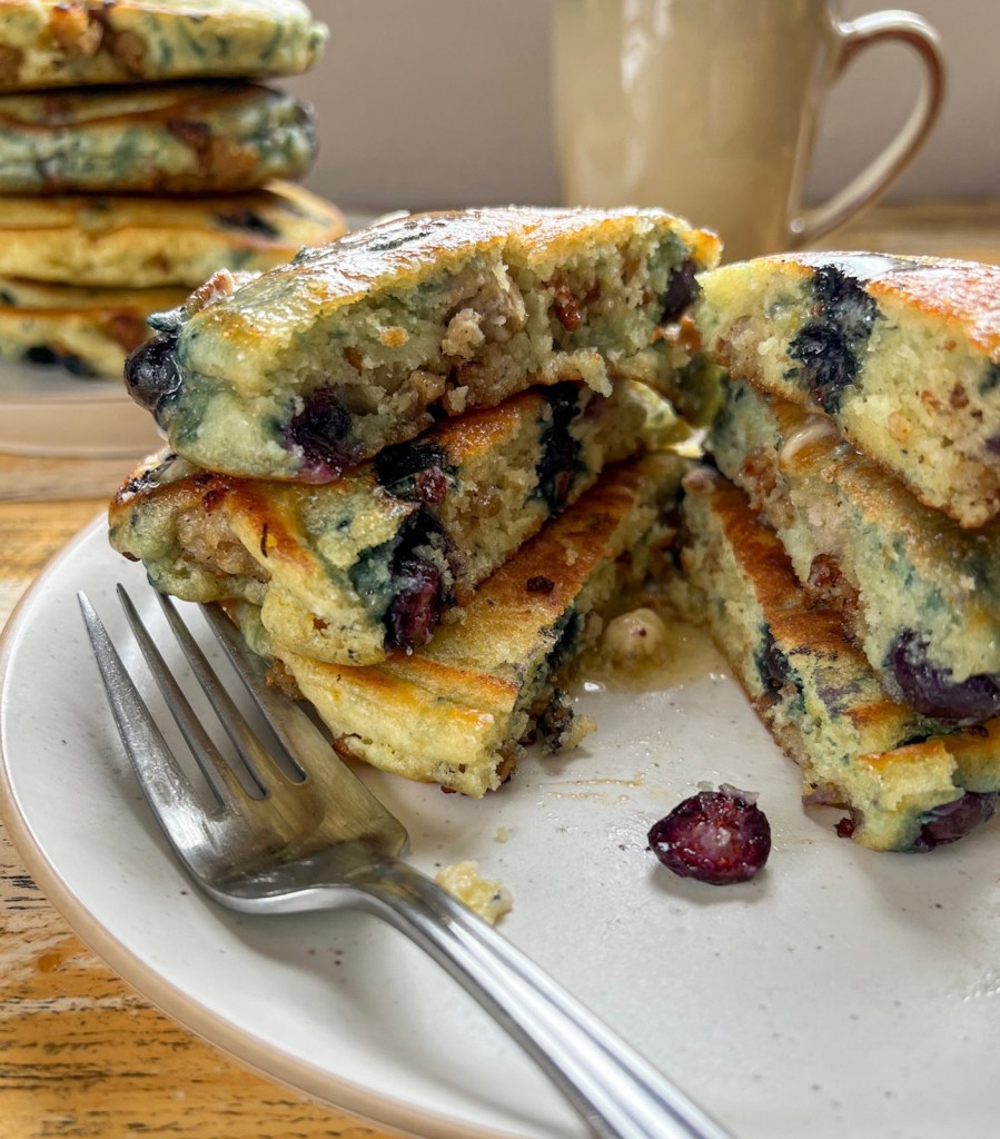 Pancakes in a stack that have been cut in half to show the middle