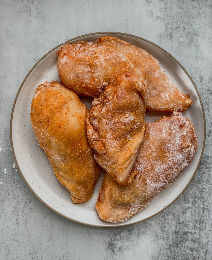 Stuffed chicken breasts just before getting pan fried
