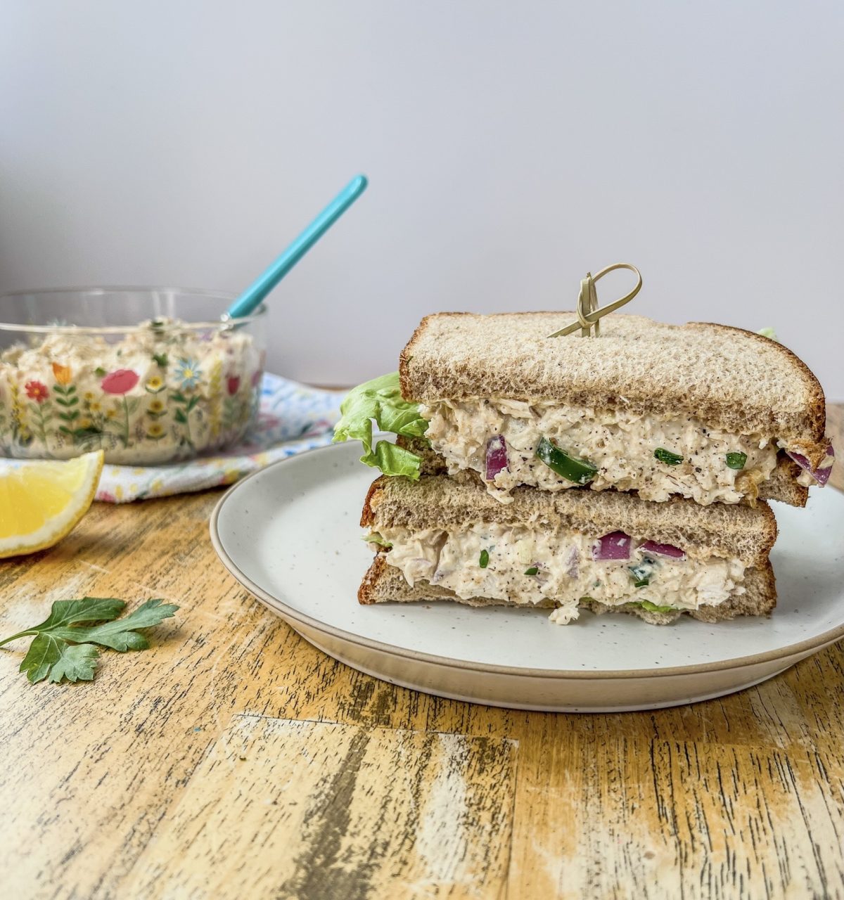 Cajun chicken salad on bread with some fresh iceberg lettuce