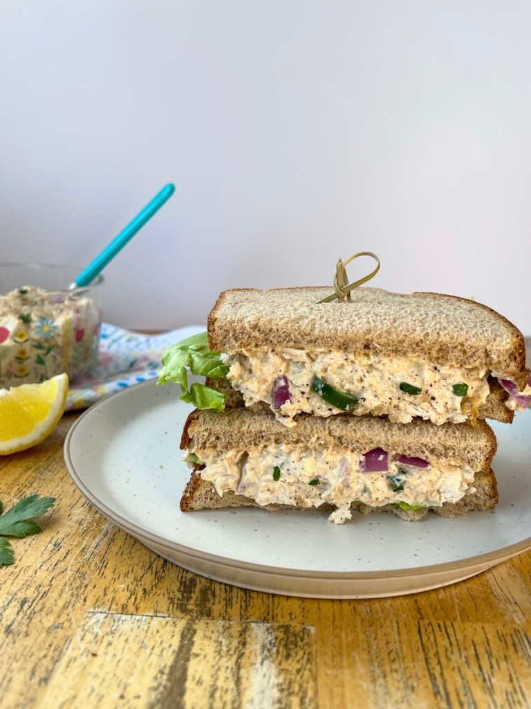 Cajun chicken salad on bread with some fresh iceberg lettuce