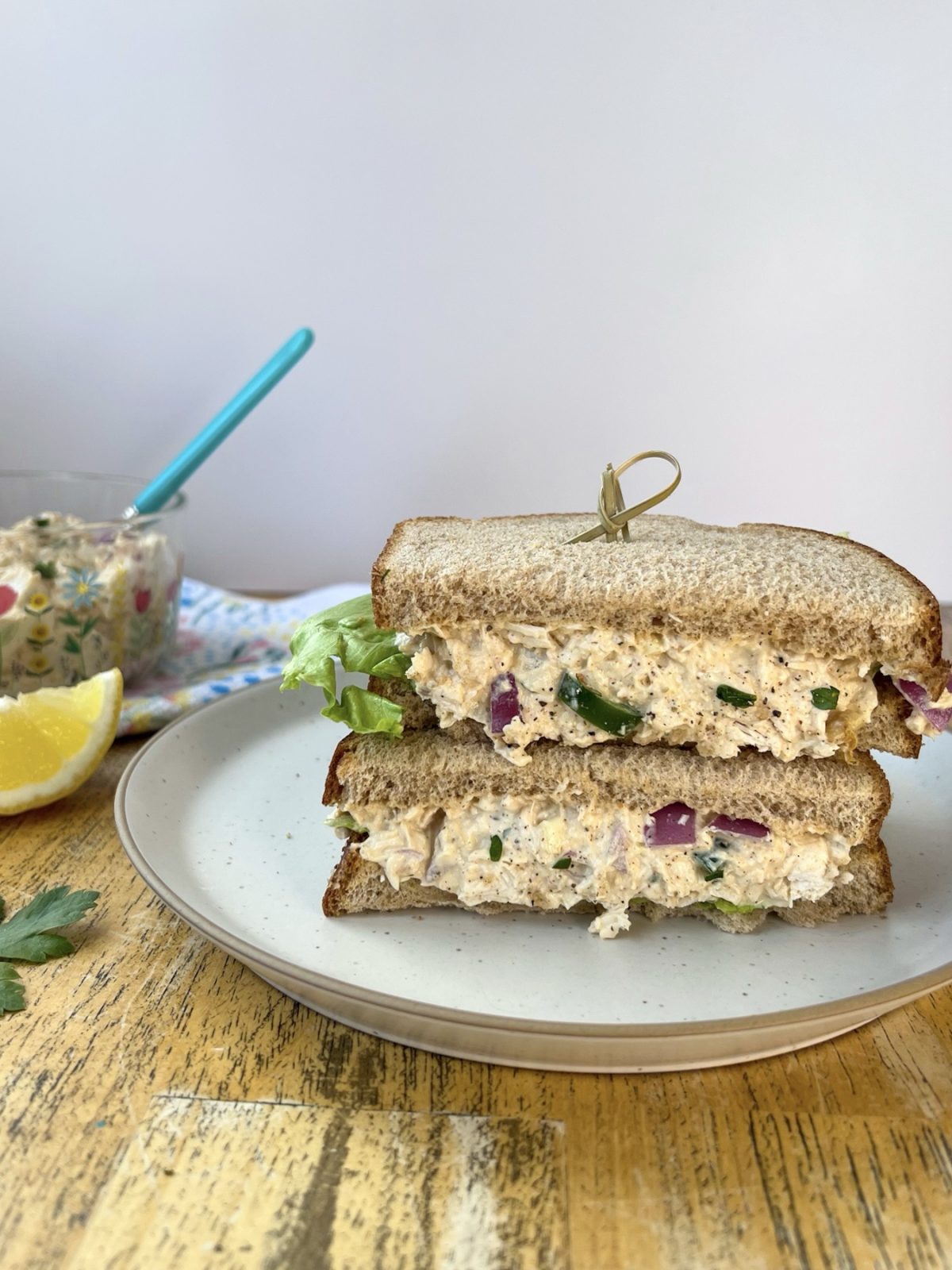 Cajun chicken salad on bread with some fresh iceberg lettuce