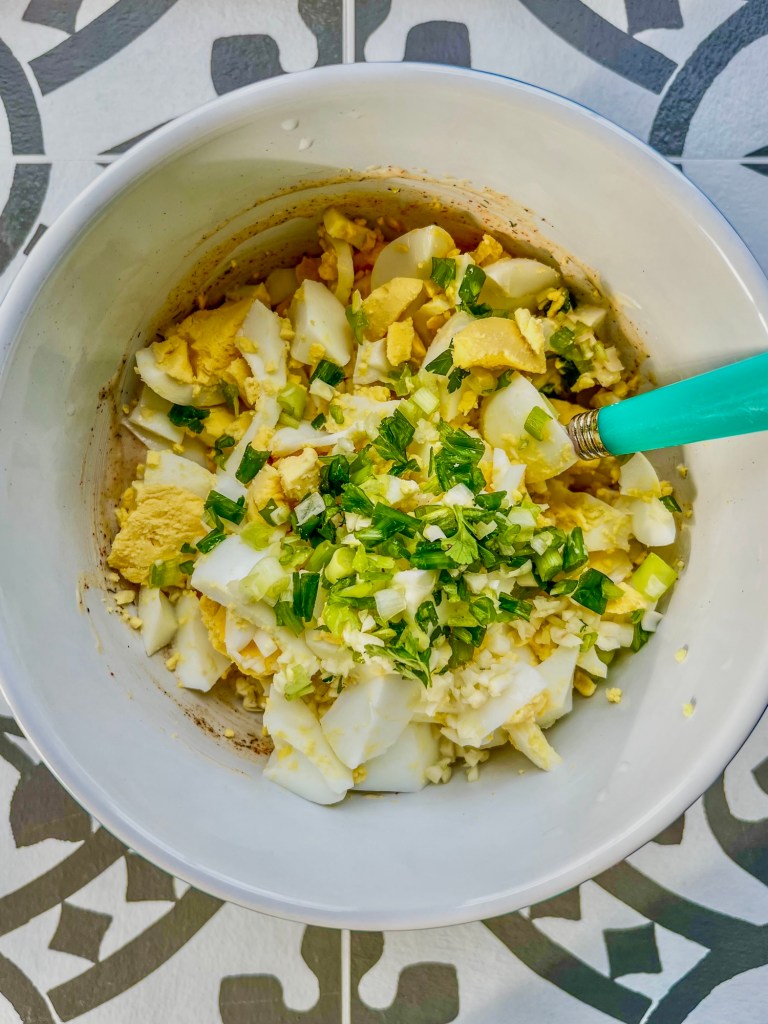 Creamy egg salad in a bowl before getting chilled