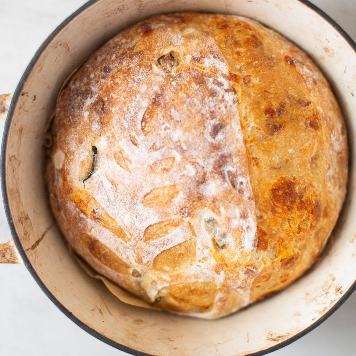 Jalapeno cheddar sourdough bread that's been cooked in a dutch oven