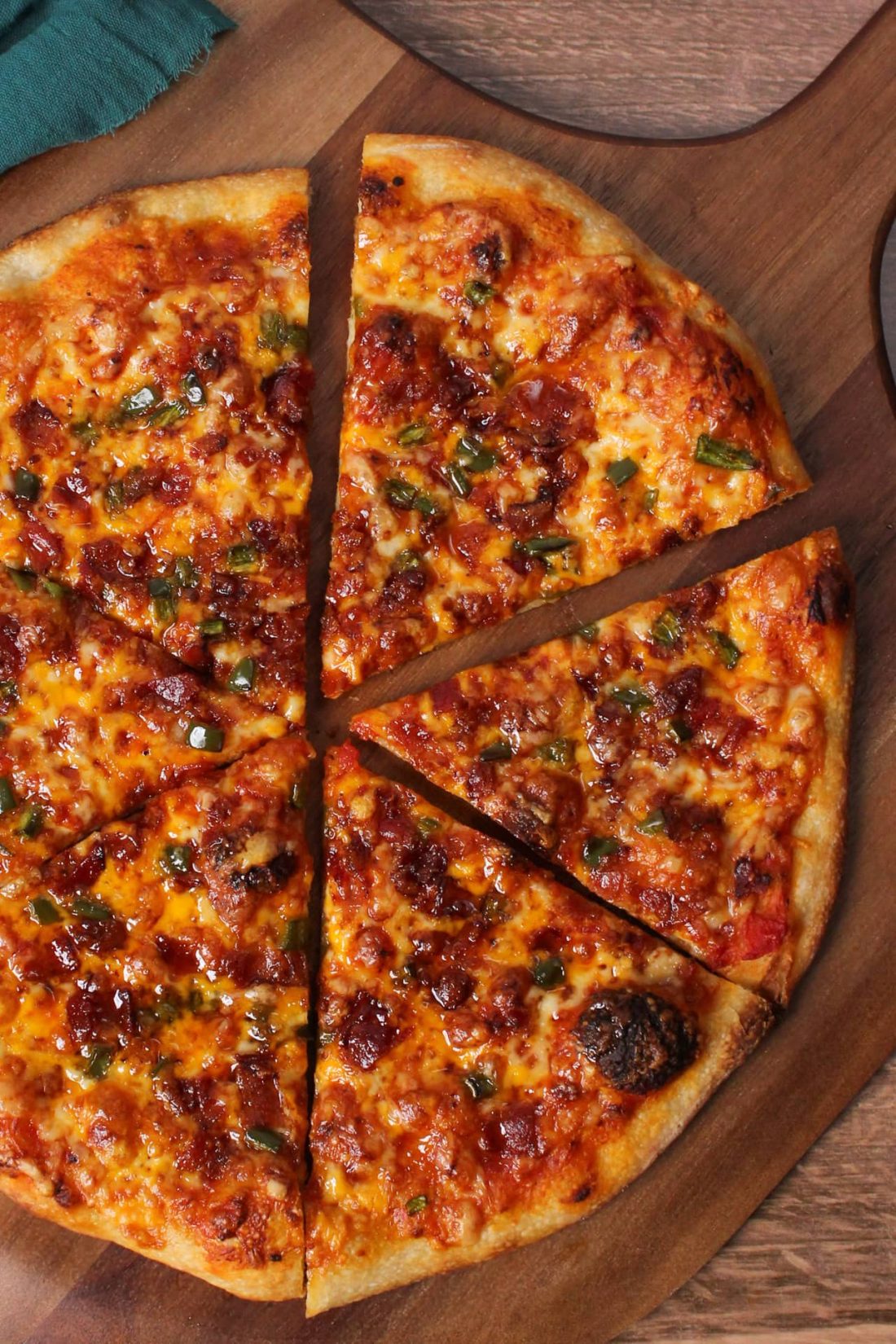 Maple bacon jalapeño pizza cut into slices