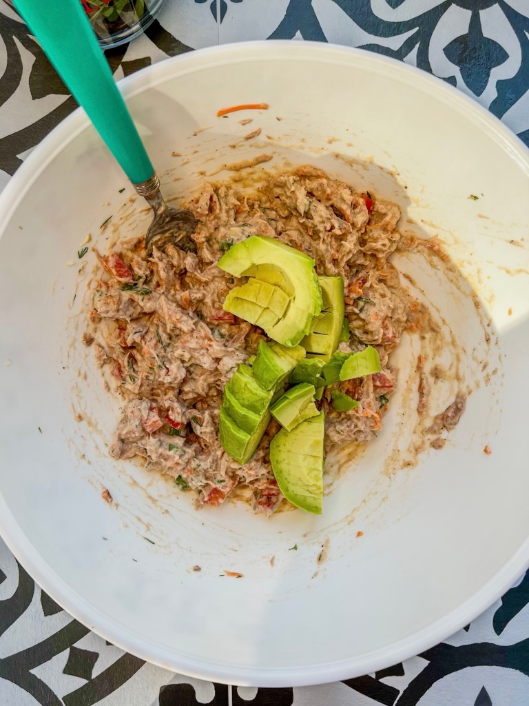 Tuna avocado filling in a mixing bowl