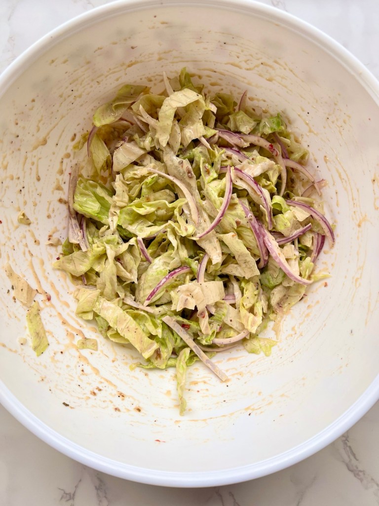 Freshly made chili grinder slaw in a large bowl