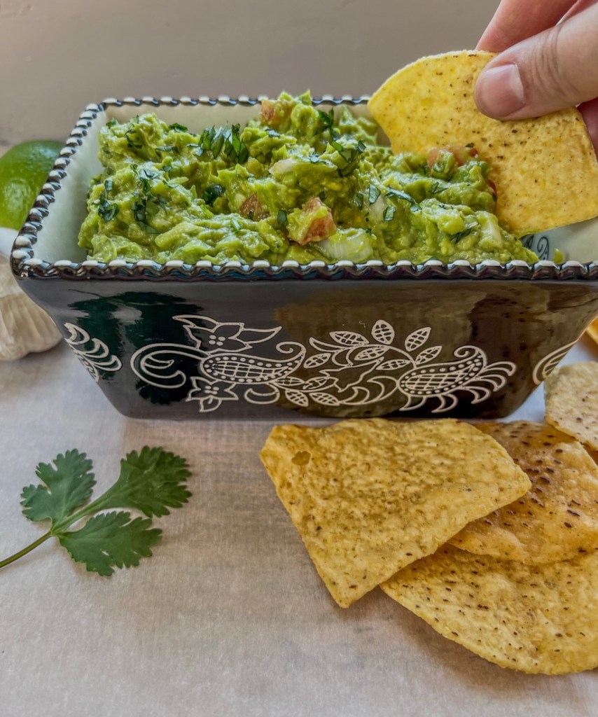 Guacamole and tortilla chips served fresh for a party snack