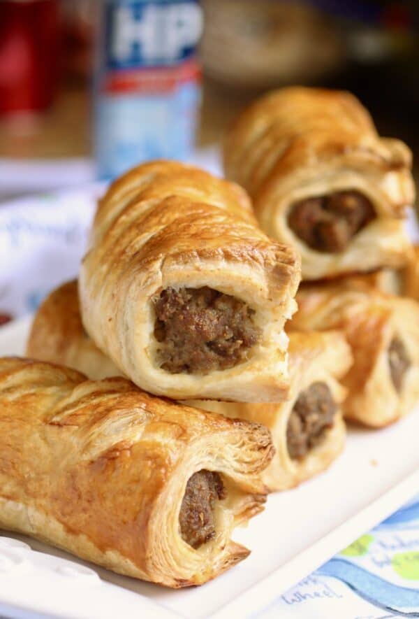 Scottish sausage rolls stacked up on a plate