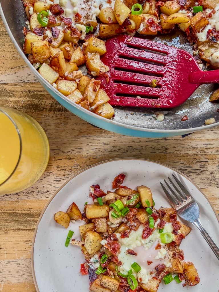 Bacon veggie breakfast hash with some orange juice on the side