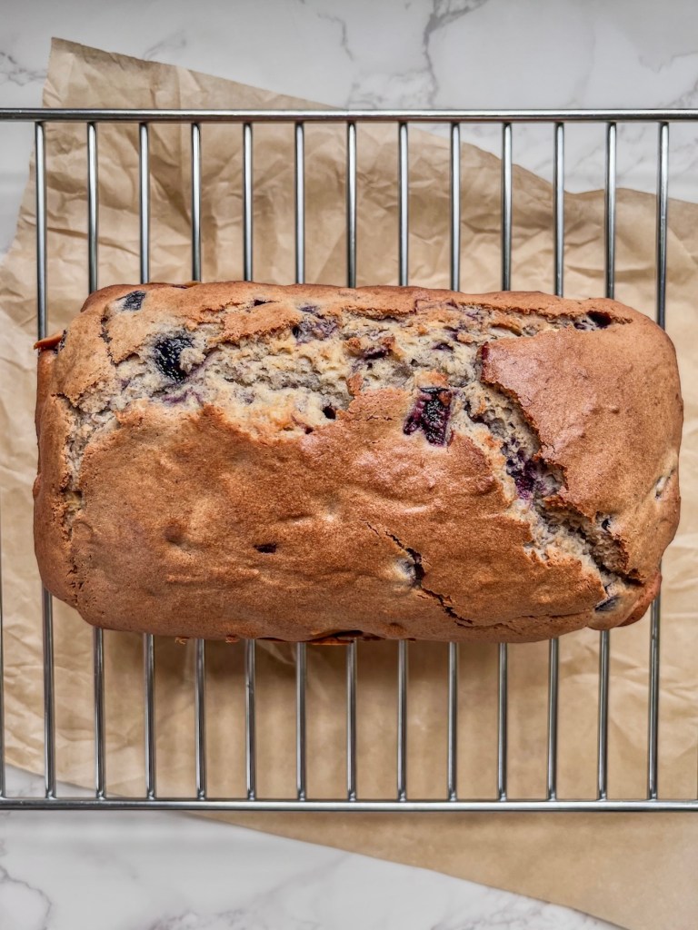 A freshly baked dessert and breakfast loaf with vanilla and cherries