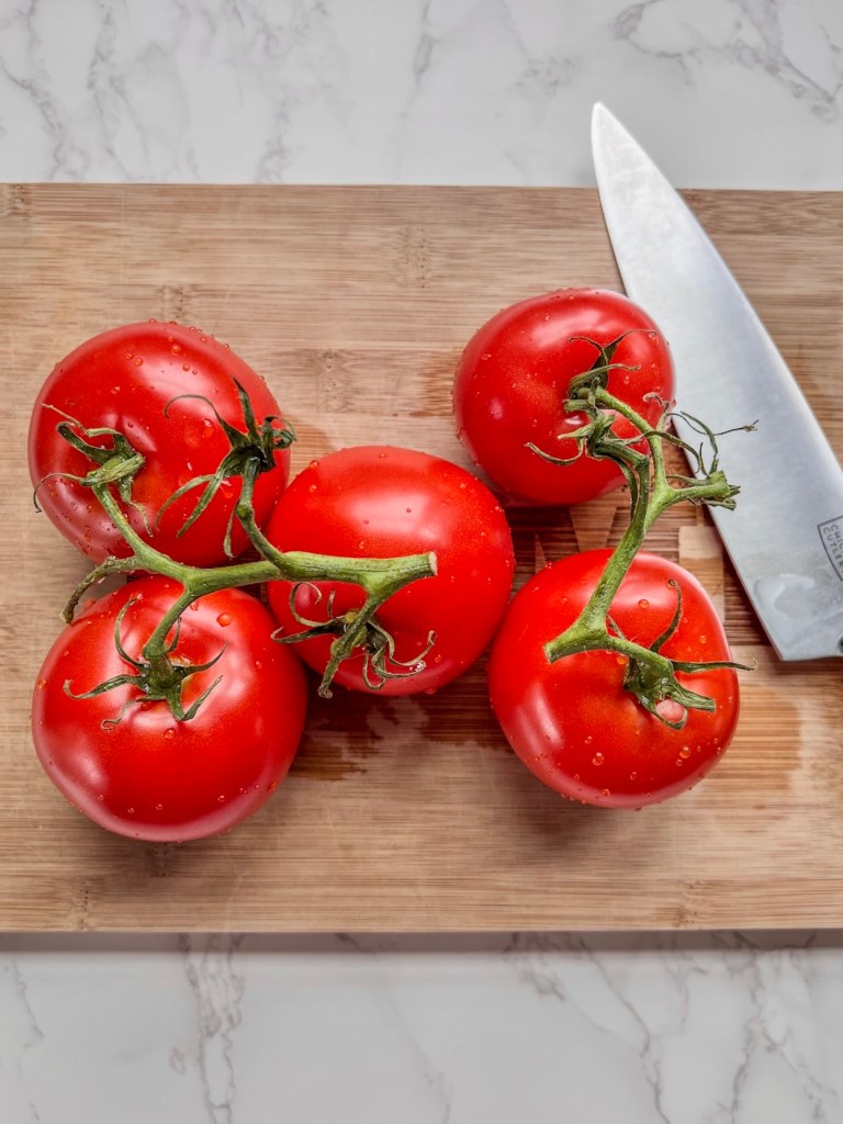 Fresh vine tomatoes on a cutting board