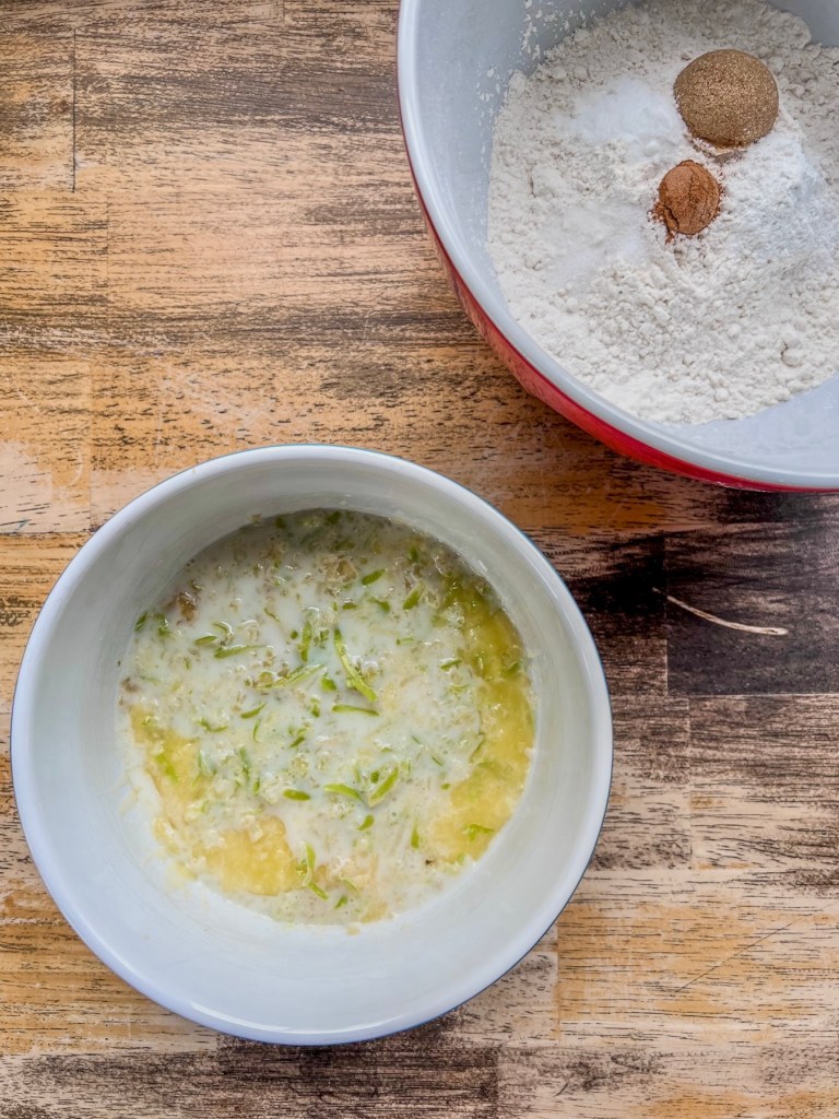 Wet and dry ingredients for apple pancakes in two separate bowls.