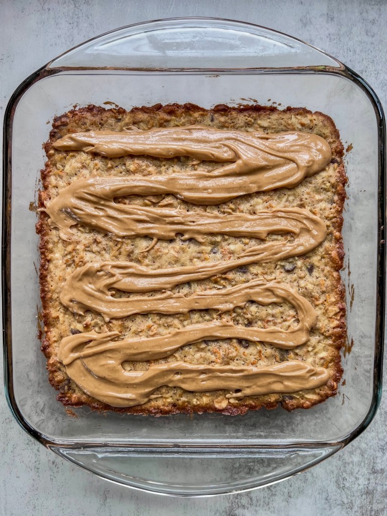 A freshly baked fall dessert with a peanut butter drizzle on top.