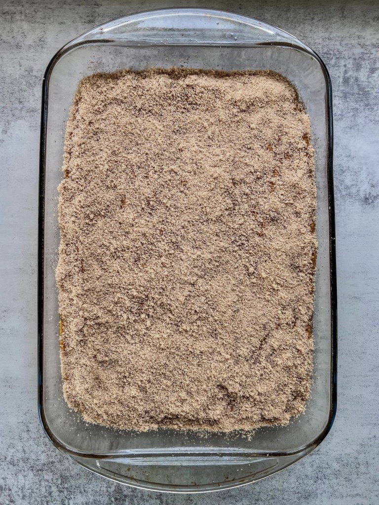 Brown butter pumpkin crumb cake with a spiced topping just before going into the oven.